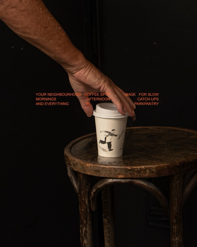 Takeaway cup on a bentwood stool